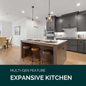 A large kitchen is pictured with a kitchen island with three stools tucked underneath. Below, it is labelled "Multi-gen featured: Expansive Kitchen."